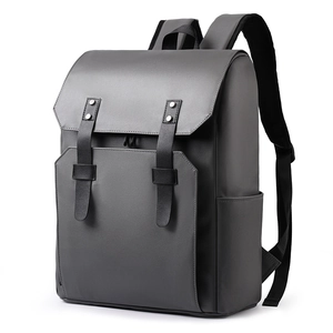 Minimalist dark grey leather business backpack with front flap and buckle detailing