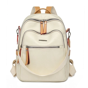 Front view of cream textured leather backpack for women with brown trim and zippers