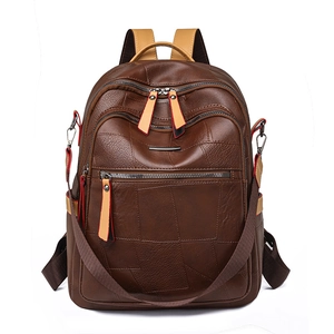 Minimalist brown faux leather multi-pocket backpack with adjustable straps and top handle