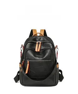 Front view detail of black lychee grain PU leather backpack with brown zipper accents