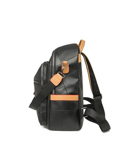 Side view detail of black PU leather backpack showing stitching and multi-zipper structure