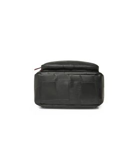 Side view detail of black leather backpack with stitched panels and red accent zipper