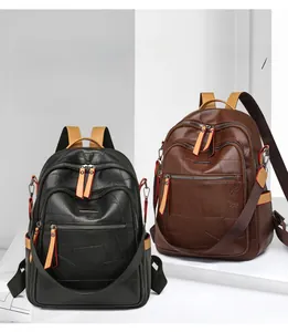 Close-up of dual vintage color-block backpacks with premium leather patchwork texture