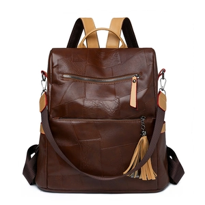 Dark brown PU leather backpack for women with patchwork design and tassel charm