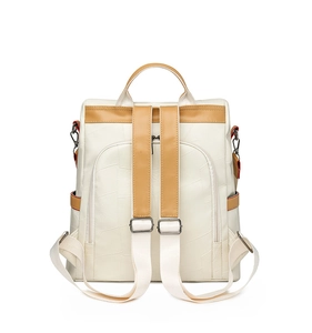 Detail view of the back side showing adjustable straps and geometric stitching texture
