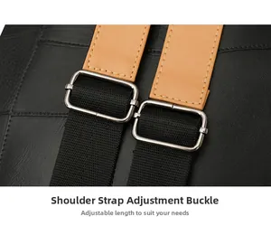 Detail of adjustable shoulder strap with silver buckle and black leather stitching