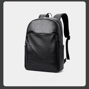 Vue latérale d'un sac à dos d'affaires en cuir grainé noir avec compartiments et poche