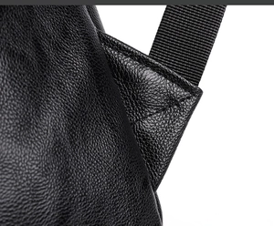 Gros plan des coutures renforcées et du cuir grainé sur un sac à dos business pour hommes