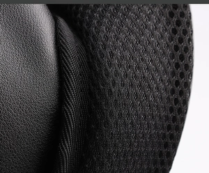 Macro shot of breathable mesh, elastic fabric and lychee texture leather on men backpack