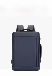 Detail view of business backpack featuring side USB charging port and waterproof fabric texture