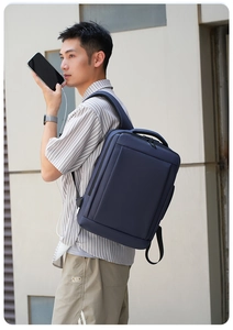 Detail of blue business backpack with external USB charging port and sleek modern design