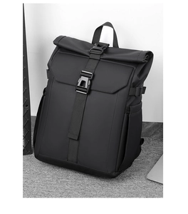 Detail of waterproof roll-top backpack with durable plastic buckles and side pockets