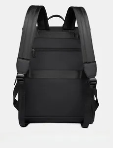 Detail view of the backpack's padded shoulder straps, luggage strap, and hidden anti-theft pocket