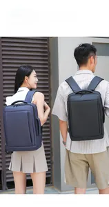 Modern business backpacks in black and navy blue featuring external USB charging ports