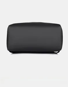 Detailed bottom view of minimalist black laptop backpack showing durable wear-resistant base