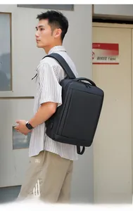 Detailed view of business backpack featuring external USB charging port on the side panel
