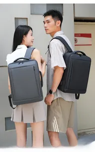 Outdoor shot of grey and black business backpacks with USB port for travel and commute