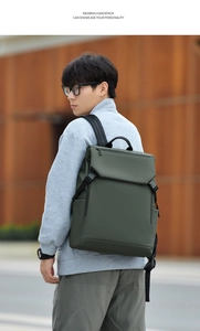 Close-up of olive green waterproof backpack featuring a large flap and metal buckles