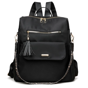 Black travel backpack for women with gold hardware and stylish leopard print shoulder strap