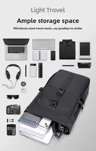 Flat lay of black travel backpack showing storage for laptop, camera and daily essentials