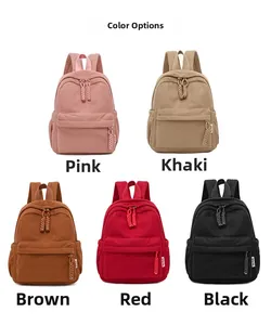 Mini corduroy rugzakken getoond in de kleuren roze, kaki, bruin, rood en zwart