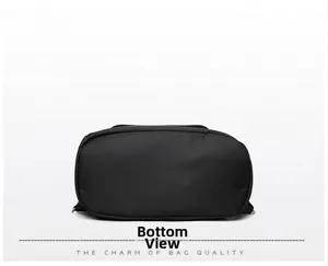 Detail view of the reinforced bottom base of a large capacity black travel backpack