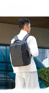 Outdoor model show of a black waterproof business backpack with ergonomic wide shoulder straps