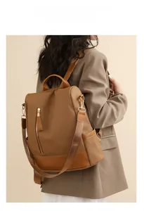 Brown woven leather backpack styled on a model in a brown blazer for a retro look