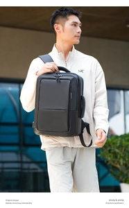 Detailed view of black multi-functional laptop backpack with side USB charging port