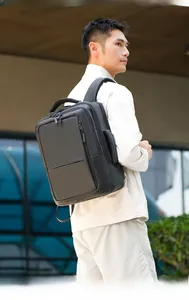 Close-up of waterproof black business backpack with padded straps and ergonomic design