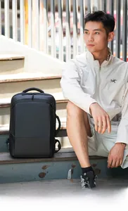 Minimalist black waterproof business backpack with side USB port and large capacity
