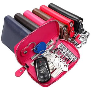 Internal view of colorful leather key case with six metal hooks and a card slot detail