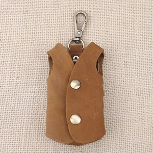 Mini leather vest car key holder with vintage brown finish and metal snap buttons