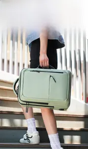 Mint green versatile laptop backpack showing hidden zipper and side handle detail