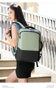 Detail of mint green and black laptop backpack featuring water-resistant matte fabric
