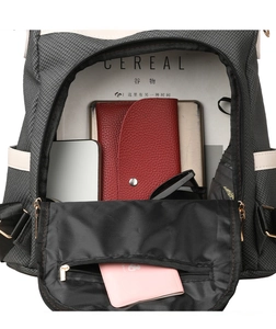 Macro view of grey woven backpack interior with laptop and travel essentials