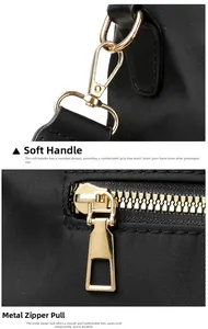 Close-up of golden metal zippers and high-density nylon fabric on black backpack