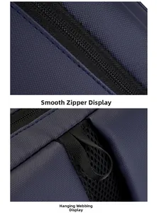 Detail of a smooth zipper and hanging strap on a navy business laptop backpack