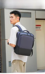 Side view of a navy blue business backpack featuring an external USB charging port and straps