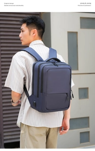Blue business laptop backpack featuring external USB port and ergonomic straps
