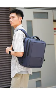 Detailed view of dark blue laptop backpack featuring integrated external USB charging port
