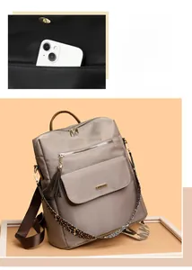 Detail view of the spacious inner compartment and pocket of the nylon backpack