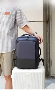 Detail of a large capacity navy business laptop backpack on a white suitcase