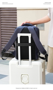 Detail of navy blue nylon backpack with luggage strap and breathable mesh on back