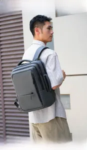 Detail of grey multifunctional backpack with multi-layer zipper and laptop compartment