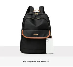 Black nylon backpack size comparison with an iPhone 12 showing product proportions
