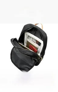 Detail view of large black backpack showing internal compartments and laptop storage