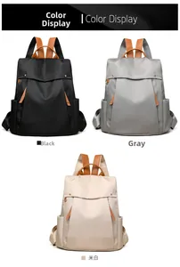 Detailed color display of large canvas backpacks in black, grey, and off-white options
