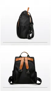 Detail view of large canvas backpack with leather straps and metal zippers for travel