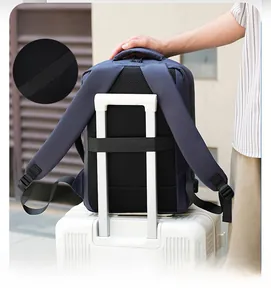 Detail of the back luggage strap on a blue laptop backpack for easy travel use